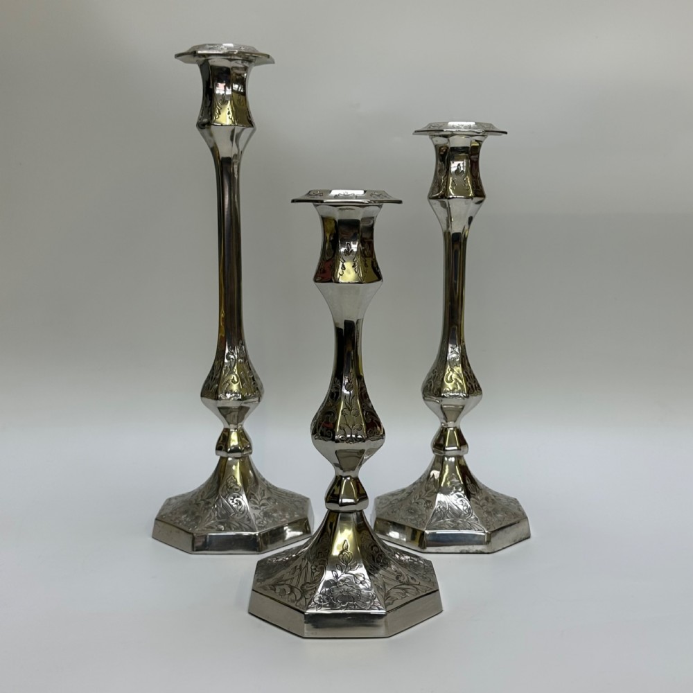 attractive set of three engraved silver plate candlesticks by john richard