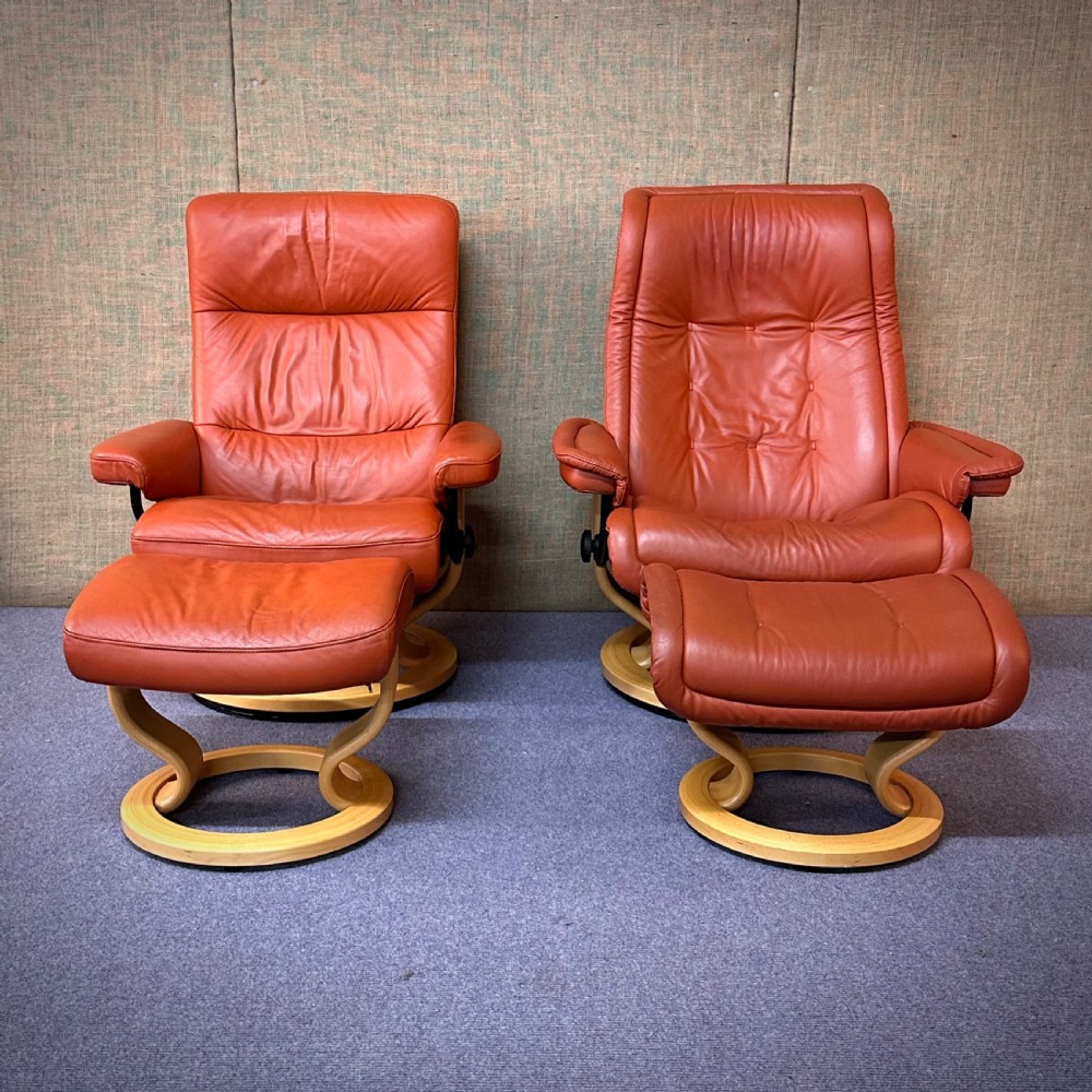 attractive pair of ekornes stressless reclining armchairs with stools