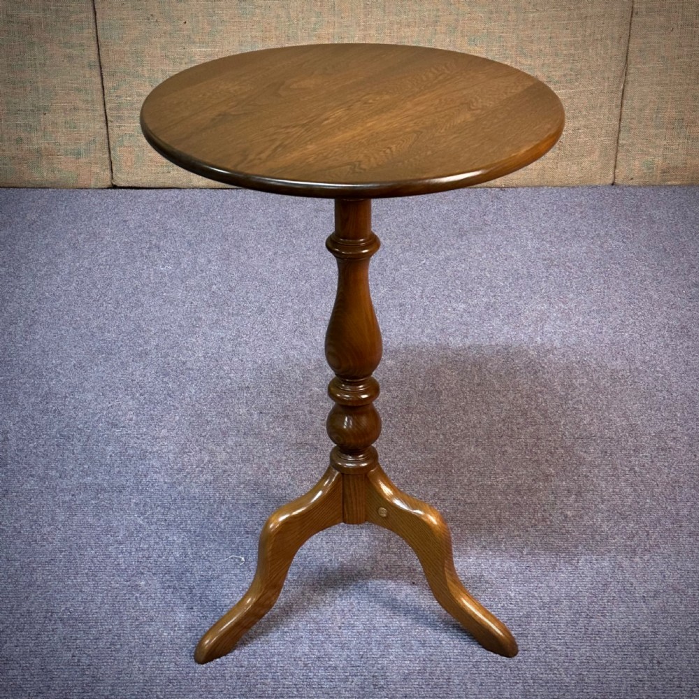 attractive ercol small elm pedestal circular side wine table